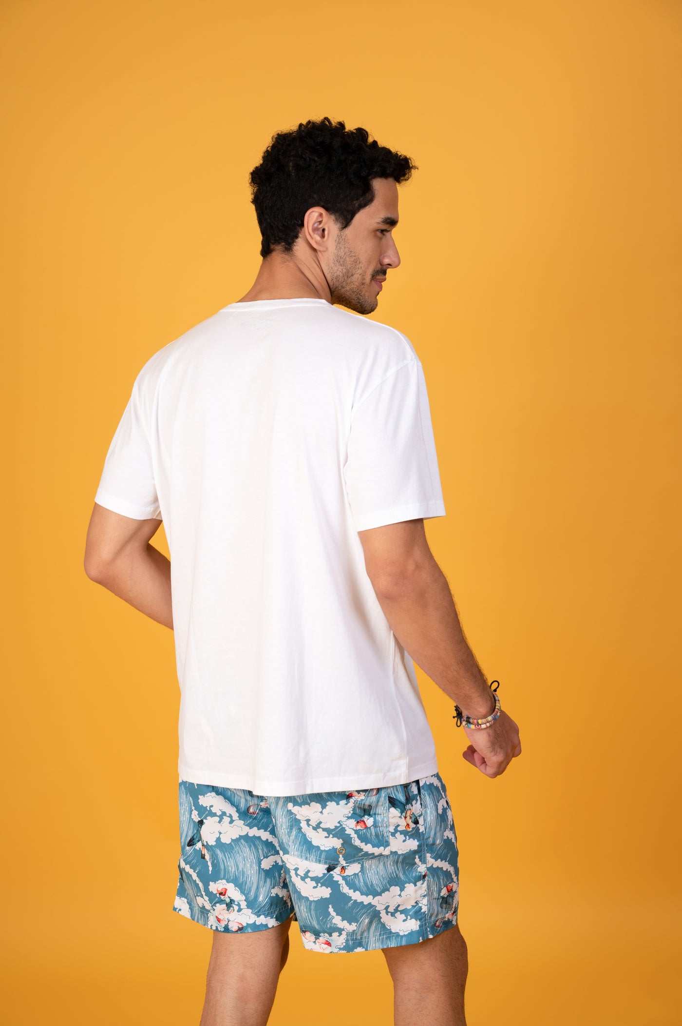 Elevate your beachwear with this comfortable and trendy white tee - Grab it now!
