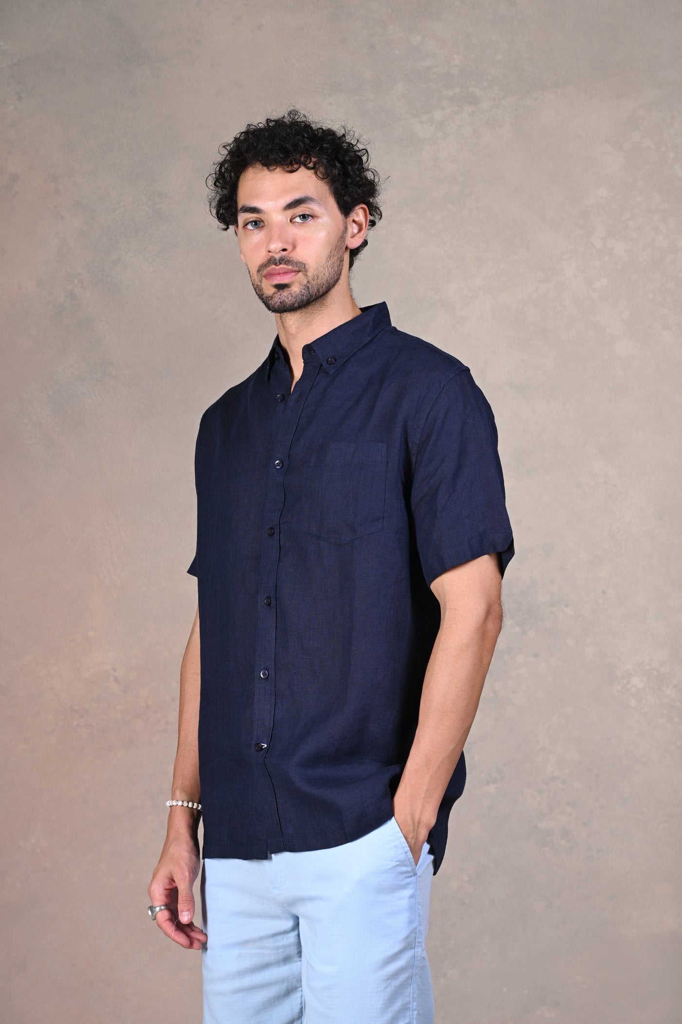 Crafted from premium linen, this half-sleeve shirt is perfect for summer - Order today!
